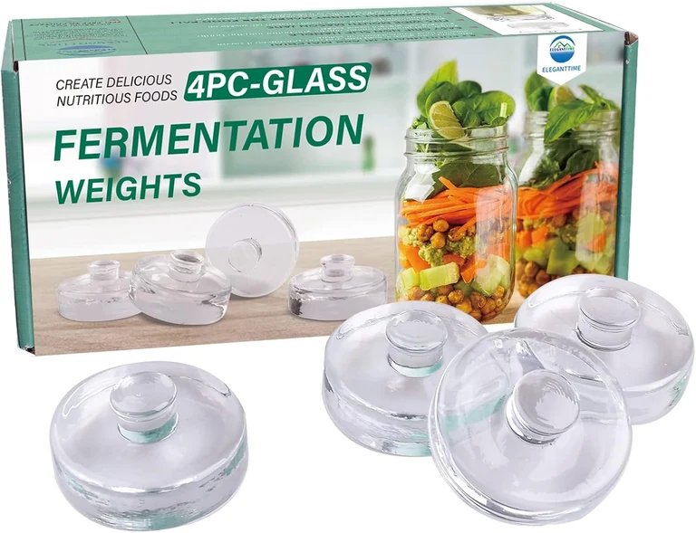 Four glass fermentation weights for wide-mouth Mason jars
